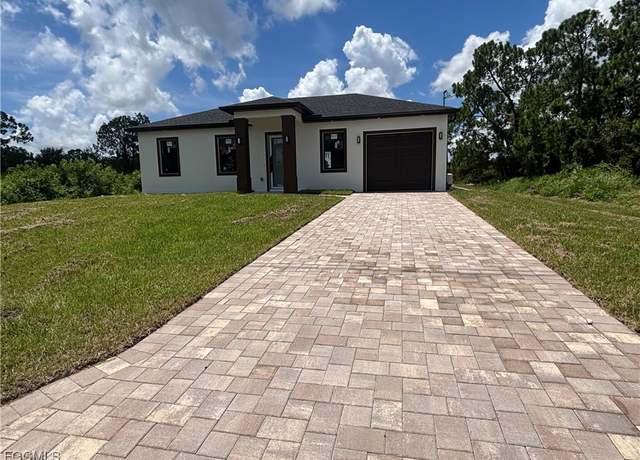 Property at 1034 Iris St E, Lehigh Acres, FL 33974, 3 beds, 3 baths