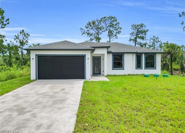 Property at 411 Eisenhower Blvd, Lehigh Acres, FL 33974, 3 beds, 2 baths