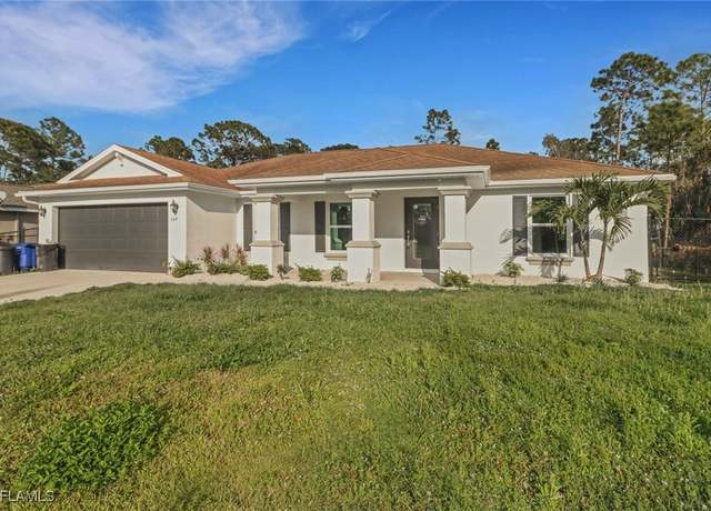 Property at 506 Hutton St E, Lehigh Acres, FL 33974, 3 beds, 2 baths