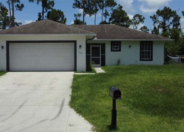Property at 709 Puccini Ave S, Lehigh Acres, FL 33974, 3 beds, 2 baths