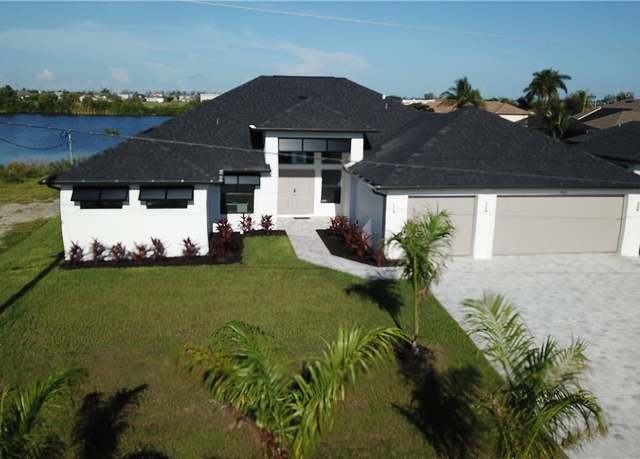 Property at 702 NW 30th Pl, Cape Coral, FL 33993, 5 beds, 3 baths