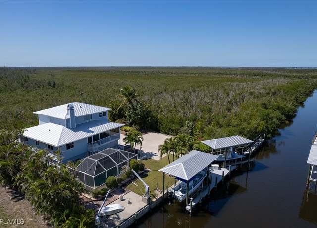 Property at 7940 Lobean Ln, Bokeelia, FL 33922, 4 beds, 3 baths