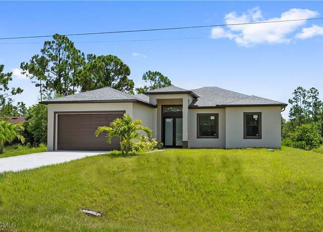 Property at 719 Fullerton Ave S, Lehigh Acres, FL 33974, 3 beds, 2 baths