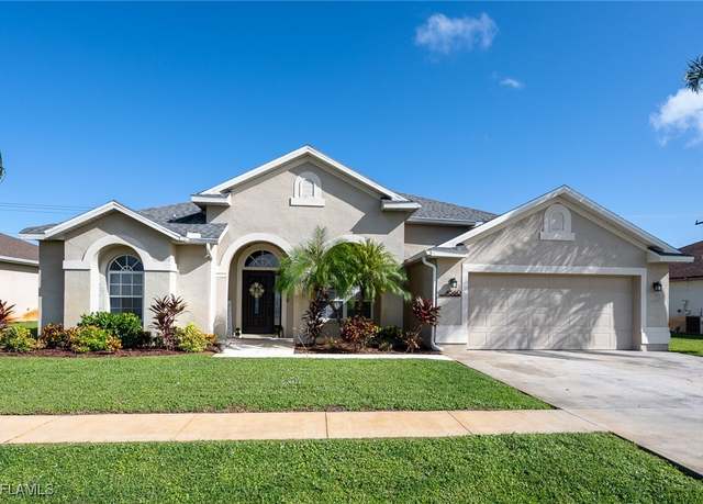 Property at 4560 Varsity Cir, Lehigh Acres, FL 33971, 4 beds, 2 baths