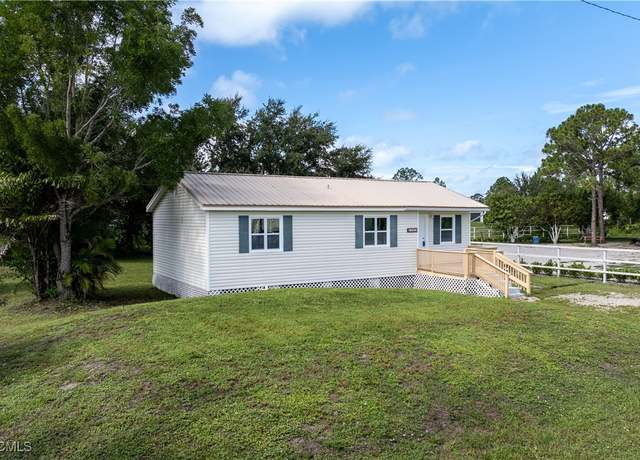 Property at 3201 44th St SW, Lehigh Acres, FL 33976, 3 beds, 2 baths