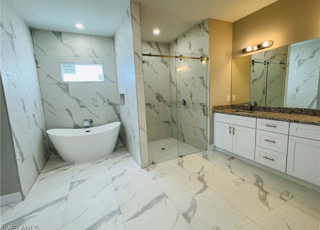 Property at 543 Mcarthur Blvd, Lehigh Acres, FL 33974, 4 beds, 2.5 baths