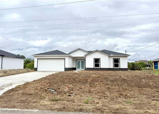 Property at 825 Porter St E, Lehigh Acres, FL 33974, 4 beds, 2.5 baths