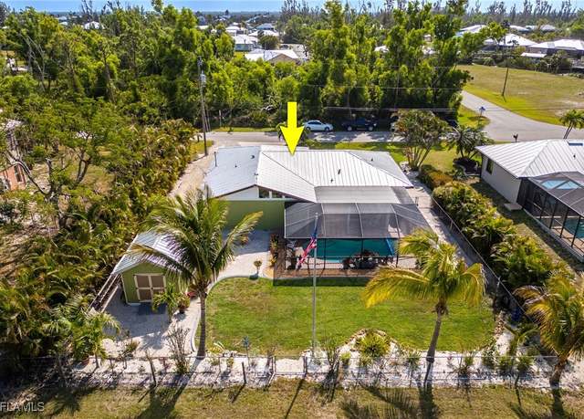Property at 11571 Oakland Dr, Bokeelia, FL 33922, 3 beds, 2 baths