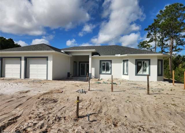 Property at 128 Bell Blvd S, Lehigh Acres, FL 33974, 4 beds, 3 baths