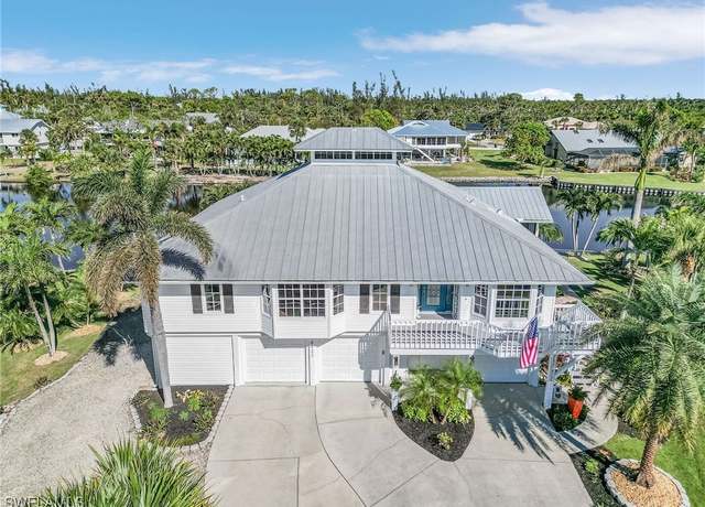 Property at 14432 Clubhouse Dr, Bokeelia, FL 33922, 4 beds, 3 baths