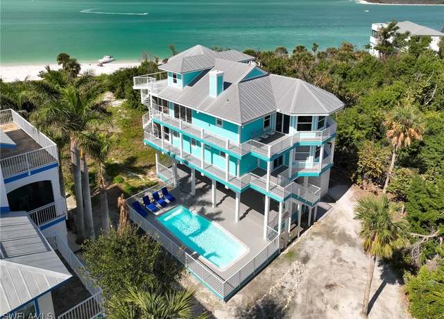 Property at 150 White Pelican Dr, Upper Captiva, FL 33924, 4 beds, 3 baths