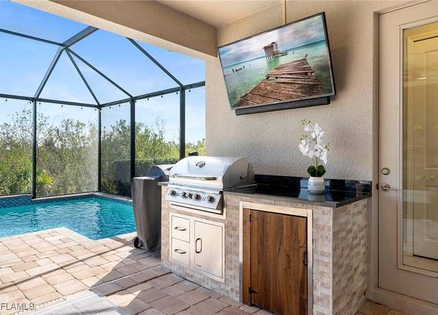 Property at 8584 Big Mangrove Dr, Fort Myers, FL 33908, 4 beds, 3.5 baths