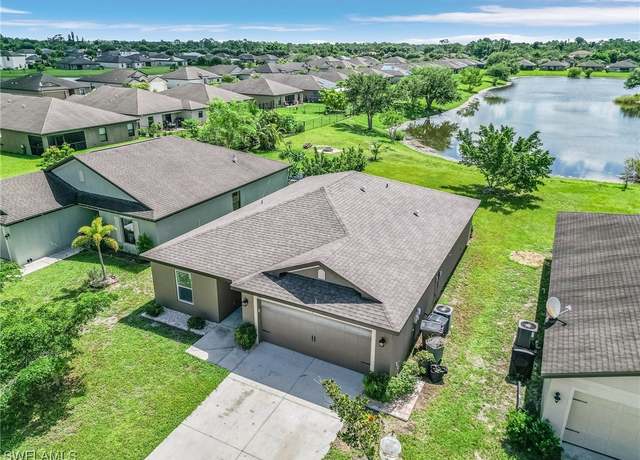 Property at 390 Shadow Lakes Dr, Lehigh Acres, FL 33974, 3 beds, 2 baths