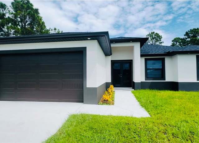 Property at 1103 E 14th St, Lehigh Acres, FL 33972, 4 beds, 2 baths