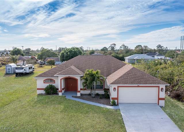Property at 1402 Fred Ave S, Lehigh Acres, FL 33976, 4 beds, 2 baths