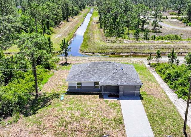 Property at 1126 Bari St E, Lehigh Acres, FL 33974, 3 beds, 2 baths