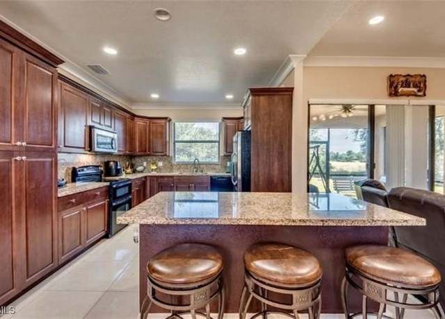 Property at 906 Sunniland Blvd, Lehigh Acres, FL 33971, 3 beds, 2.5 baths