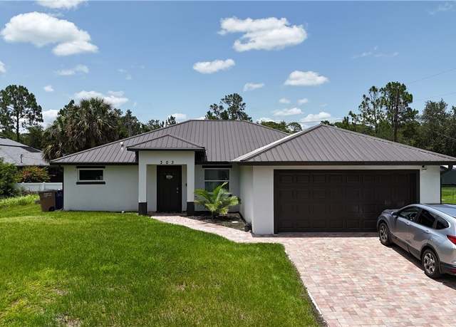 Property at 303 E 7th St, Lehigh Acres, FL 33972, 4 beds, 2 baths