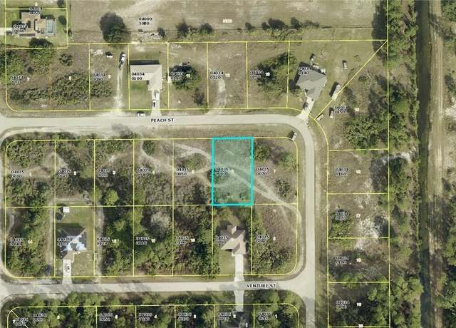 Property at 1058 Peach St, Lehigh Acres, FL 33974