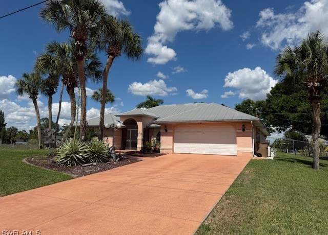 Property at 1200 Elaine Ave N, Lehigh Acres, FL 33971, 3 beds, 2.5 baths