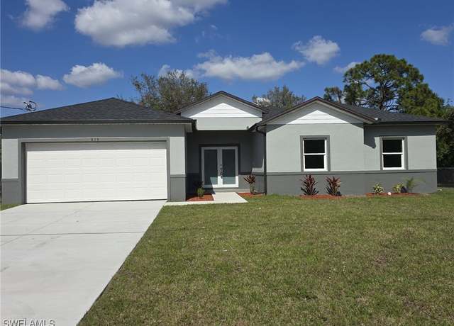 Property at 815 Sentinela Blvd, Lehigh Acres, FL 33974, 4 beds, 2.5 baths