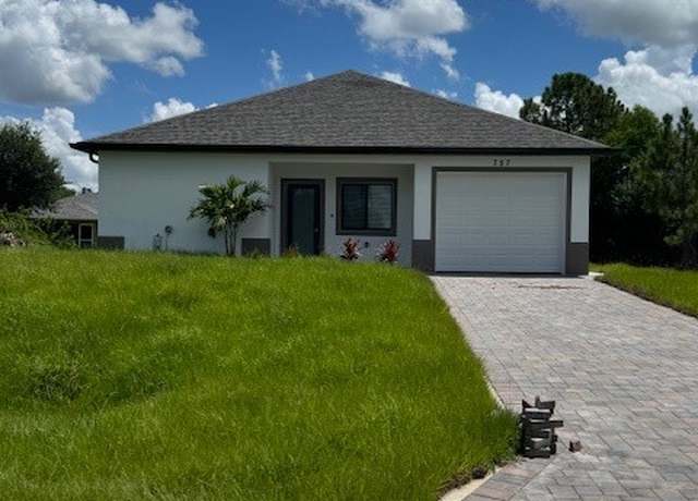 Property at 757 Chelsea Ave S, Lehigh Acres, FL 33974, 4 beds, 3 baths