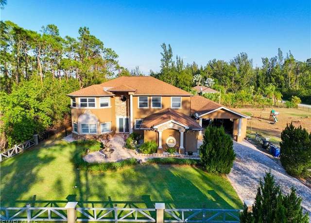 Property at 1702 Highland Ave, Lehigh Acres, FL 33972, 5 beds, 4.5 baths