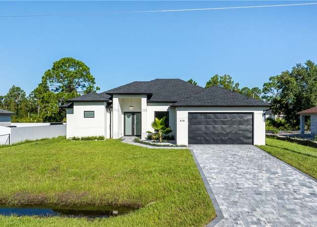 Property at 618 Parker Ave S, Lehigh Acres, FL 33974, 3 beds, 2 baths
