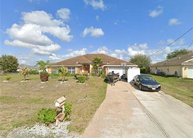 Property at 1018 Chapel Ave, Lehigh Acres, FL 33971, 4 beds, 3 baths