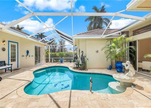 Property at 914 Spanish Moss Trl, Naples, FL 34108, 4 beds, 3 baths