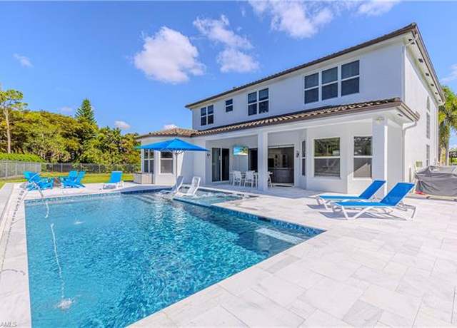 Property at 1801 Senegal Date Dr, Naples, FL 34119, 4 beds, 3.5 baths