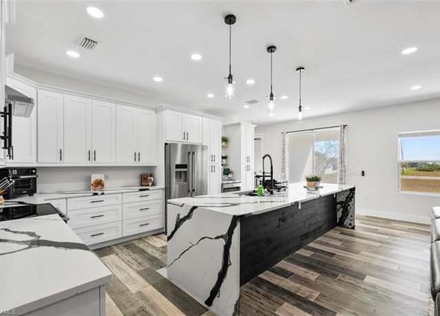 Property at 1217 NW 42nd Ave, Cape Coral, FL 33993, 4 beds, 3 baths