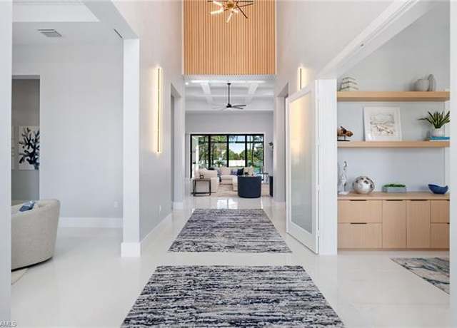 Property at 10 Caribbean Rd, Naples, FL 34108, 5 beds, 5 baths