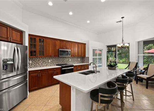 Property at 15533 Vallecas Ln, Naples, FL 34110, 4 beds, 3 baths