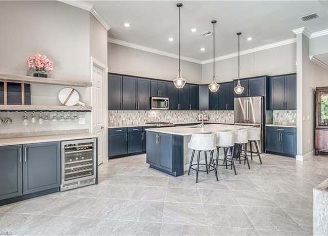 Property at 9246 Plover Dr, Naples, FL 34120, 4 beds, 4.5 baths
