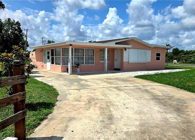 Property at 10 E Jersey Rd, Lehigh Acres, FL 33936, 4 beds, 3 baths