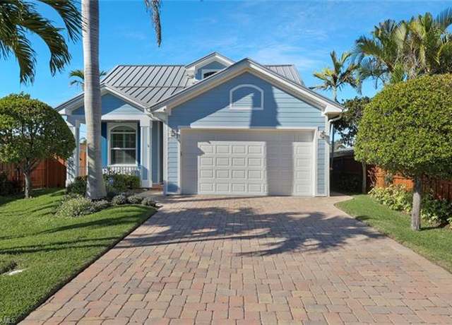 Property at 583 91st Ave N, Naples, FL 34108, 4 beds, 3.5 baths