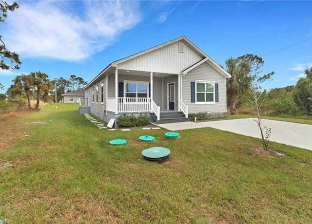 Property at 837 Da Vinci Ave S, Lehigh Acres, FL 33974, 4 beds, 2.5 baths