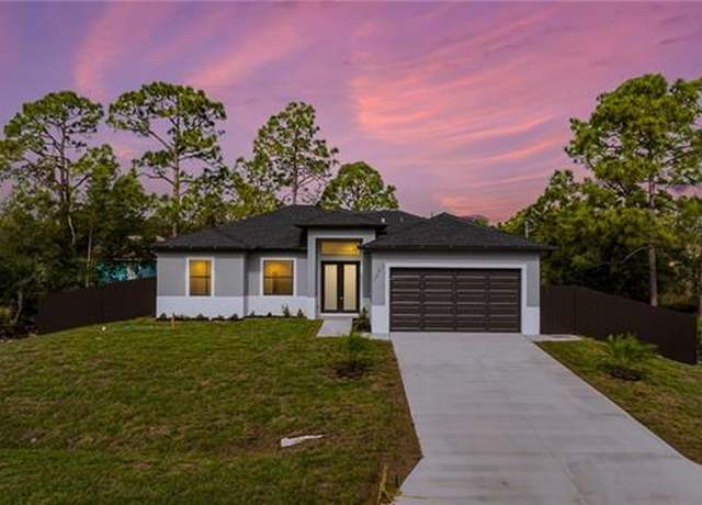 Property at 1042 Bassinger Ave S, Lehigh Acres, FL 33974, 4 beds, 2 baths
