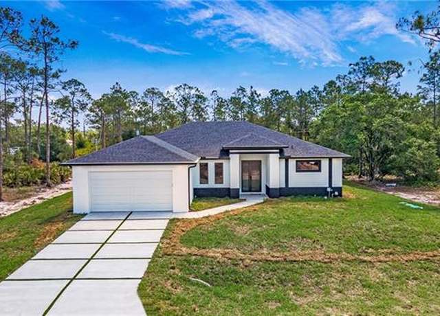 Property at 1420 Poinsettia Ave, Lehigh Acres, FL 33972, 4 beds, 2.5 baths