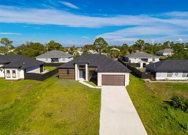 Property at 3202 40th St SW, Lehigh Acres, FL 33976, 3 beds, 2.5 baths