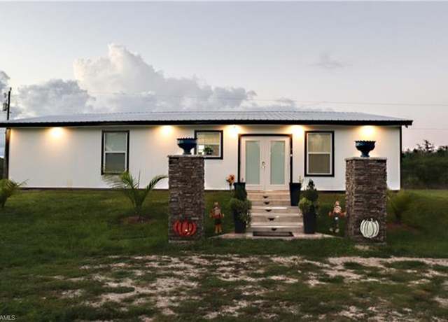 Property at 3931 42nd Ave SE, Naples, FL 34117, 4 beds, 4 baths