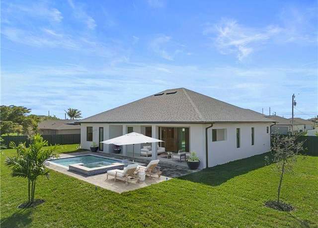 Property at 611 NW 25th Ter, Cape Coral, FL 33993, 4 beds, 3 baths
