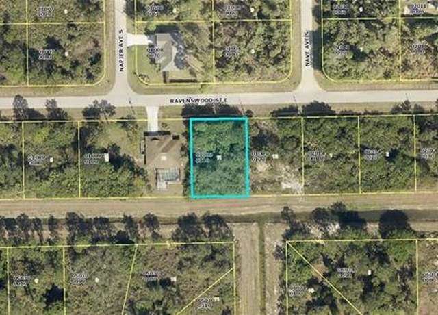 Property at 1128 Ravenswood St E, Lehigh Acres, FL 33974
