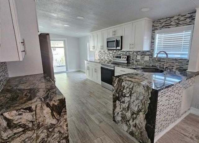 Property at 207 Plantation Blvd, Lake Worth, FL 33467, 4 beds, 2 baths