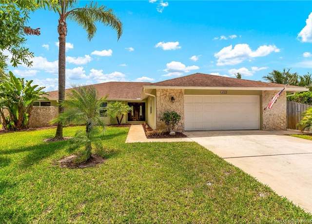 Property at 1022 SW Poplar Ct, Palm City, FL 34990, 4 beds, 3.5 baths