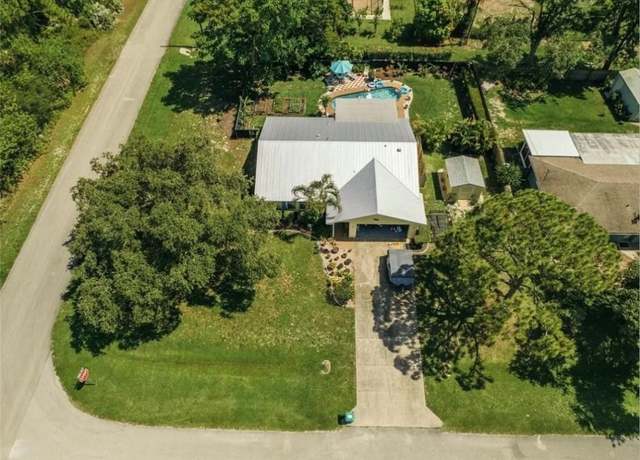 Property at 7301 E Coquina Ave NE, Fort Pierce, FL 34951, 3 beds, 2 baths