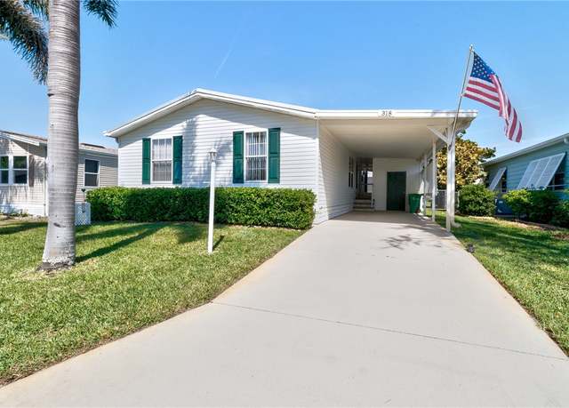 Property at 318 Macadamia Dr, Barefoot Bay, FL 32976, 3 beds, 2 baths