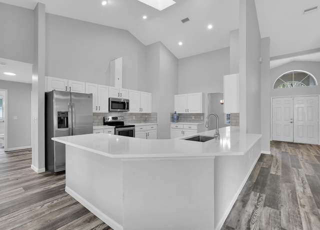 Property at 61 Brownstone Ln, Palm Coast, FL 32137, 4 beds, 3 baths
