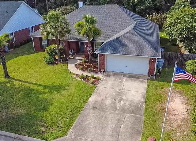 Property at 7034 Brighton Oaks Blvd, Navarre, FL 32566, 4 beds, 3 baths